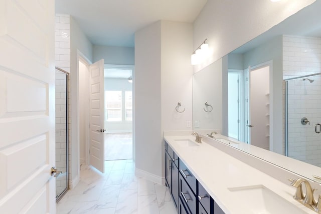 bathroom featuring vanity and an enclosed shower