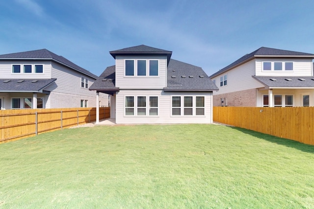 rear view of house with a lawn