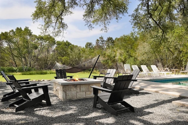 11505 SW Oaks, Austin, TX 78737 - view of patio with an outdoor fire pit and an outdoor pool