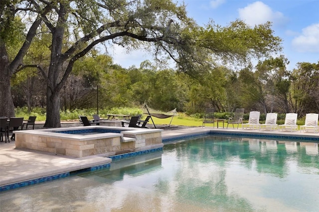 11505 SW Oaks, Austin, TX 78737 - view of swimming pool featuring a patio area and a pool with connected hot tub
