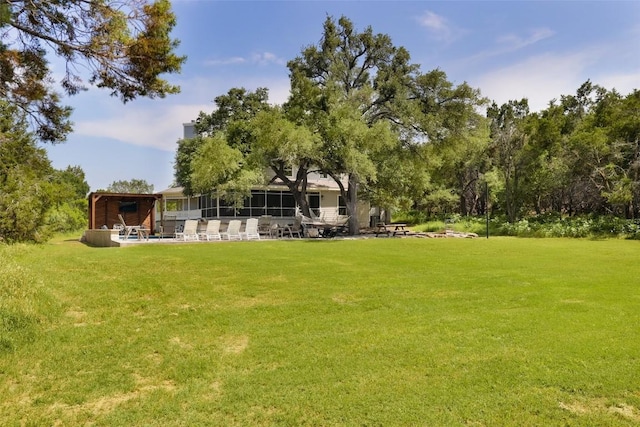 11505 SW Oaks, Austin, TX 78737 - view of green lawn with a sunroom