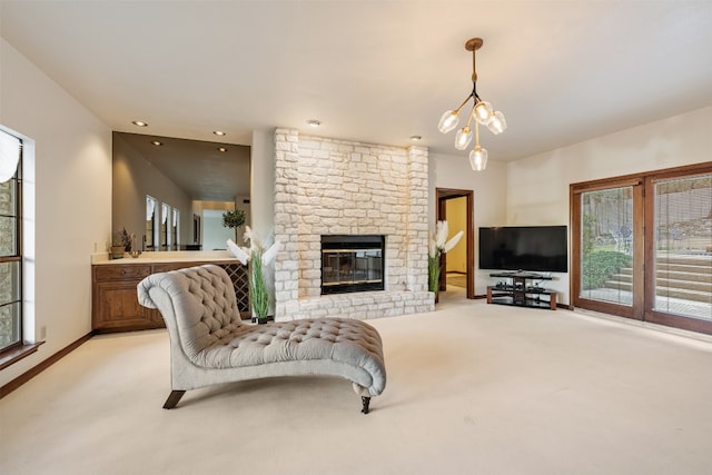 living room with light carpet and a chandelier