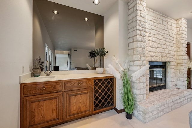 interior space with a fireplace and vanity