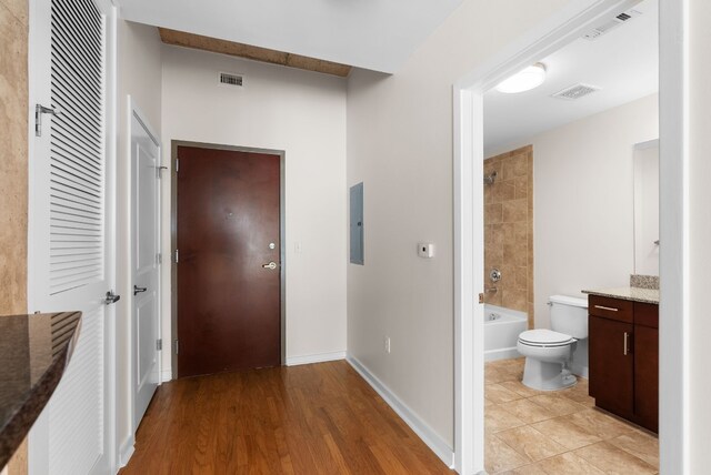 360 Nueces St Unit 2506, Austin, TX 78701 - hallway with light wood-style floors and baseboards