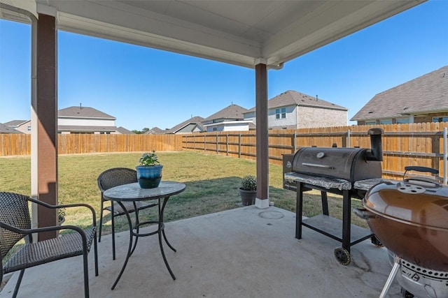 13104 Cerro Castellan Trce, Manor, TX 78653 - fenced backyard featuring a patio, area for grilling, and a residential view