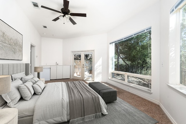 bedroom featuring carpet floors, french doors, visible vents, and baseboards