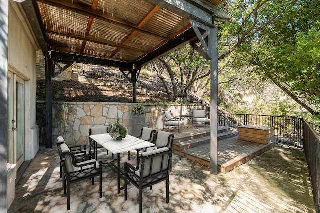 view of patio / terrace featuring outdoor dining space and a wooden deck