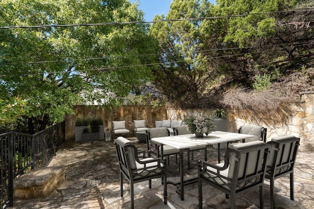 view of patio / terrace with outdoor dining area and fence