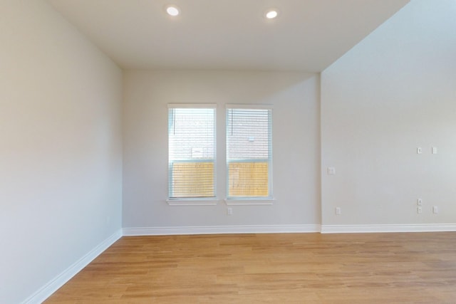 spare room with light hardwood / wood-style flooring