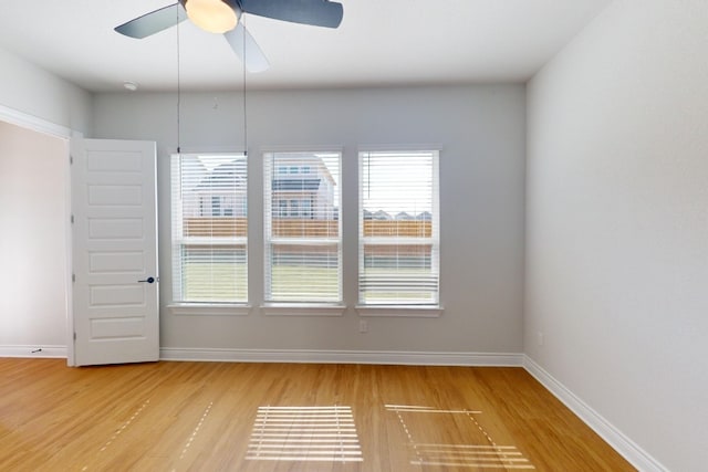 empty room featuring ceiling fan and light hardwood / wood-style floors