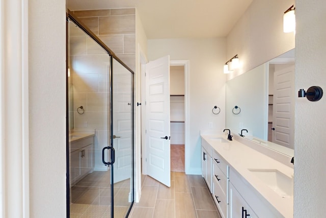 bathroom with vanity, tile patterned floors, and a shower with shower door