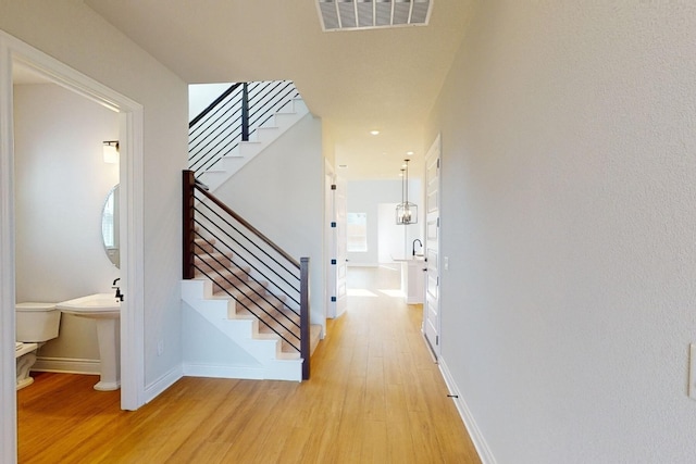 stairs with wood-type flooring