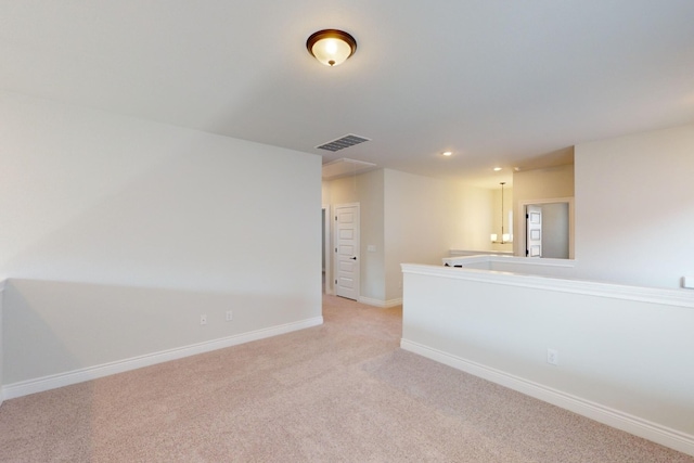 unfurnished room with light colored carpet