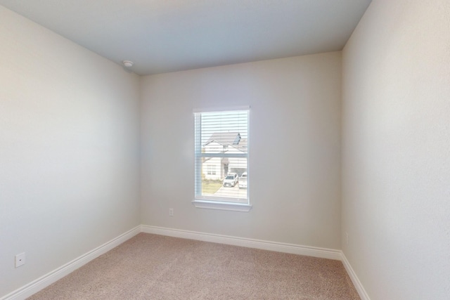 empty room featuring light carpet