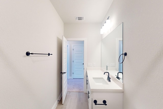 bathroom with tile patterned flooring and vanity