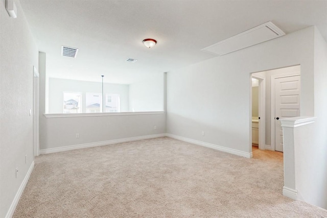 spare room with light colored carpet