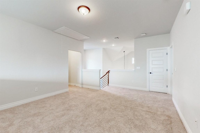 unfurnished room featuring light carpet