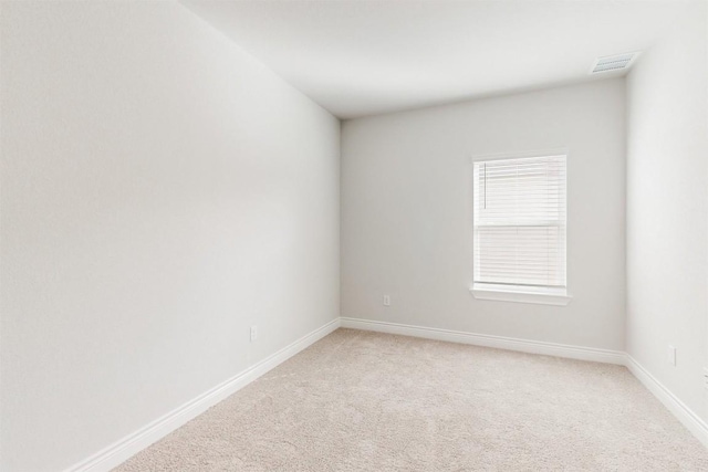 empty room featuring carpet flooring