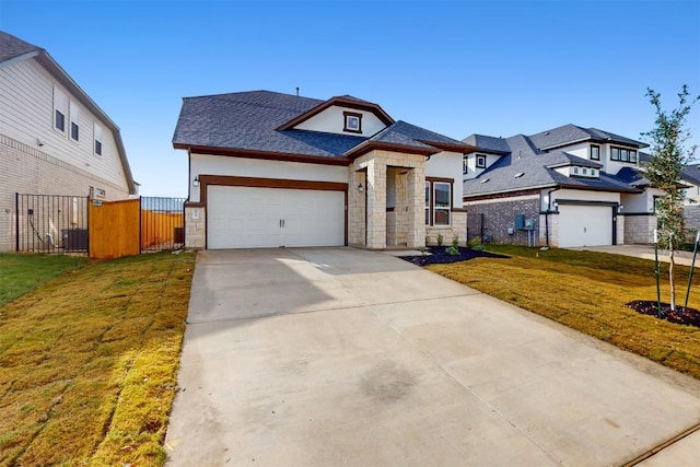 view of front facade with a front yard and a garage