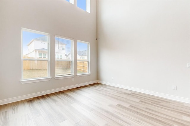 spare room featuring light wood-type flooring