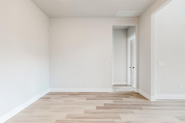 spare room featuring light hardwood / wood-style floors