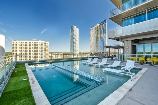 view of pool featuring a patio area