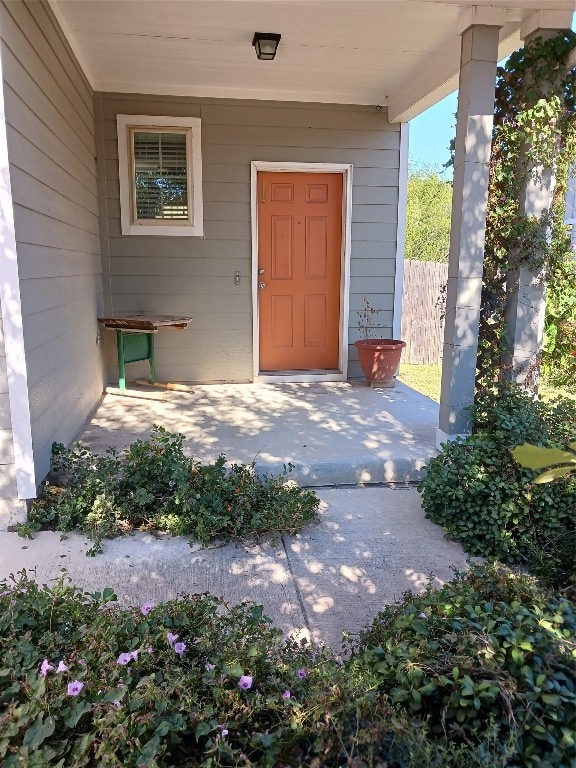 doorway to property featuring covered porch