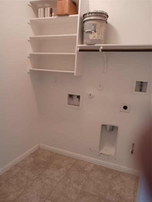 clothes washing area featuring electric dryer hookup, hookup for a washing machine, gas dryer hookup, and tile patterned flooring