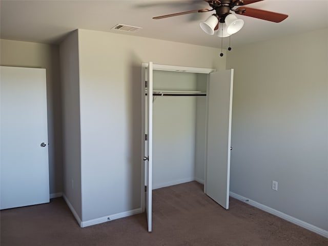 unfurnished bedroom featuring a closet, ceiling fan, and carpet