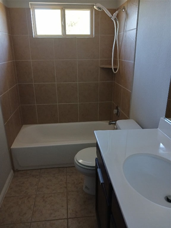 full bathroom with vanity, tiled shower / bath combo, toilet, and tile patterned flooring