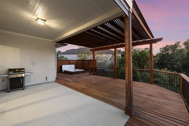 deck at dusk featuring a mountain view, grilling area, a patio area, and a hot tub