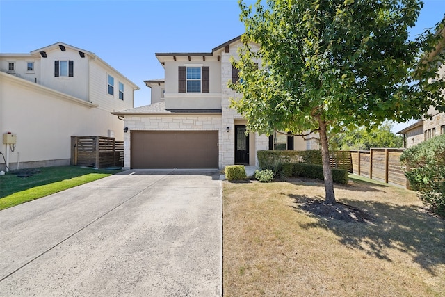 view of front of house featuring a front yard and a garage