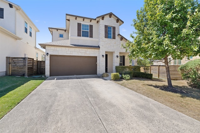 view of front of home featuring a front yard and a garage