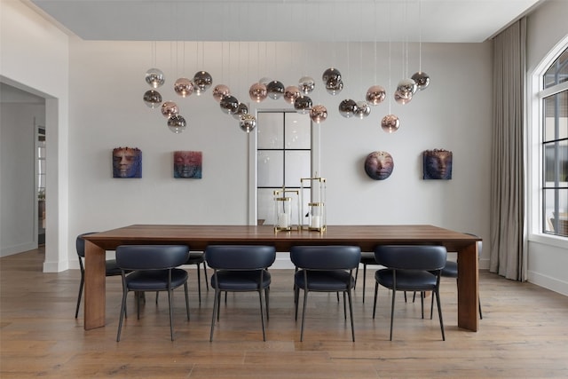 dining area featuring light wood-type flooring