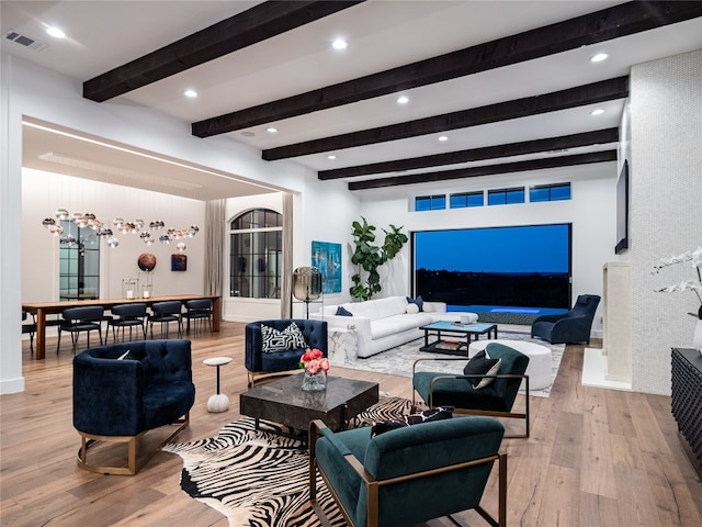 living room with beam ceiling, wood finished floors, visible vents, and recessed lighting