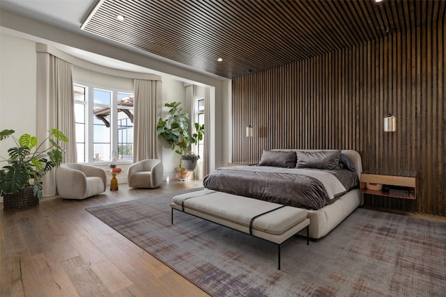 bedroom with hardwood / wood-style floors