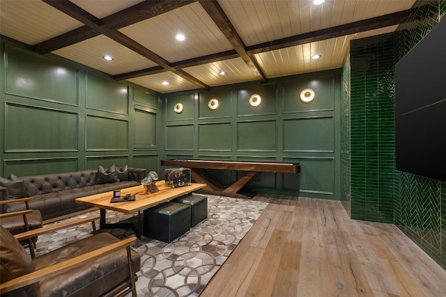 miscellaneous room featuring light wood-style floors, beamed ceiling, wooden ceiling, and a decorative wall