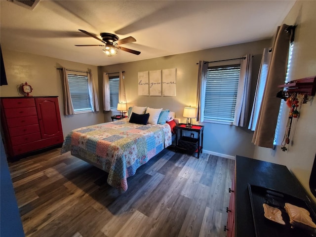 bedroom featuring dark wood-type flooring and ceiling fan