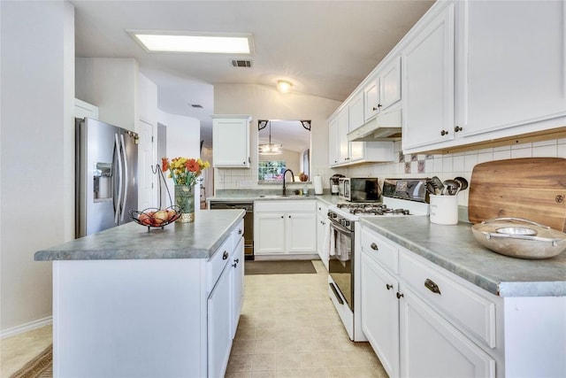 4316 Campo Verde Dr, Austin, TX 78749 - kitchen with gas range gas stove, stainless steel fridge, under cabinet range hood, a sink, and dishwashing machine