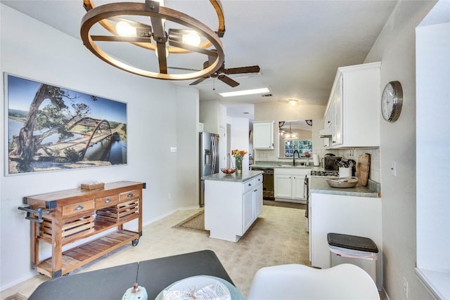 4316 Campo Verde Dr, Austin, TX 78749 - kitchen with dishwasher, white cabinetry, a center island, decorative backsplash, and a sink