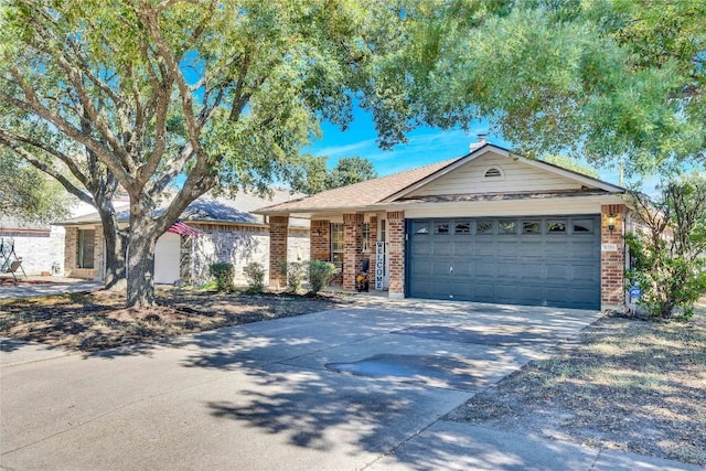 4316 Campo Verde Dr, Austin, TX 78749 - single story home with concrete driveway, brick siding, and an attached garage