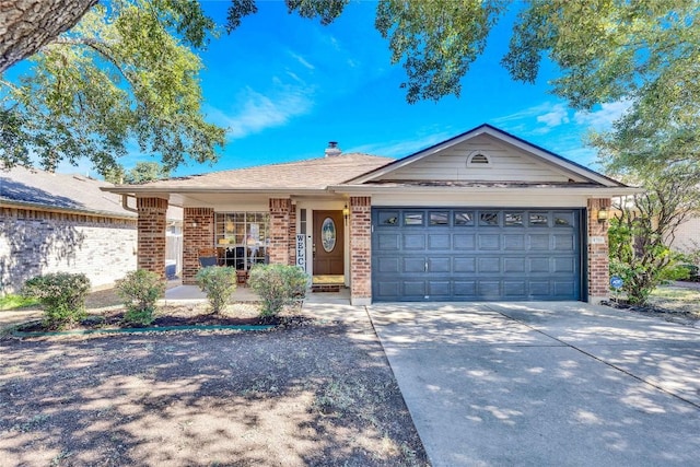 4316 Campo Verde Dr, Austin, TX 78749 - single story home with brick siding, a garage, concrete driveway, and a chimney