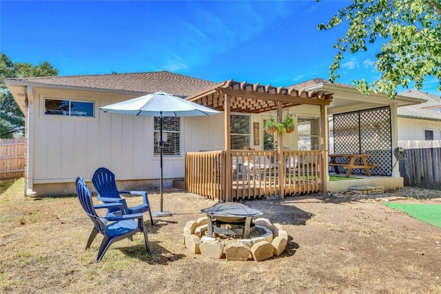 4316 Campo Verde Dr, Austin, TX 78749 - rear view of property with a fire pit, fence, a wooden deck, and a pergola