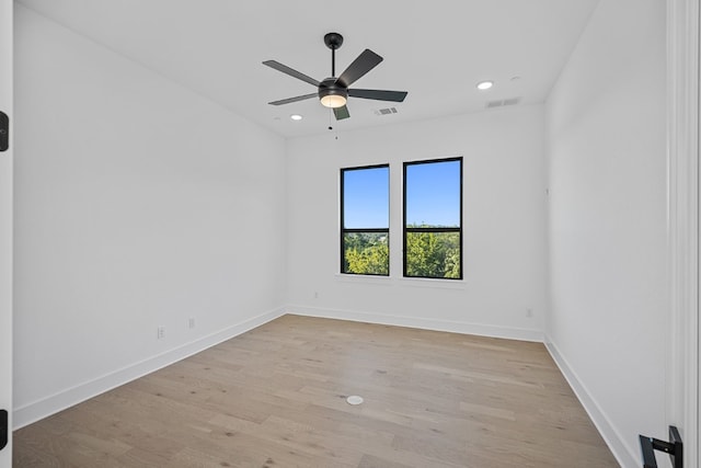 spare room with ceiling fan and light hardwood / wood-style flooring