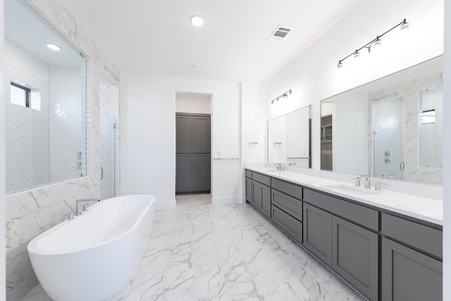 bathroom with independent shower and bath and vanity