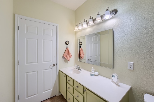 bathroom with tile patterned floors and vanity