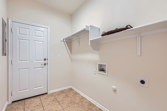 laundry area with electric dryer hookup, hookup for a gas dryer, light tile patterned floors, and hookup for a washing machine