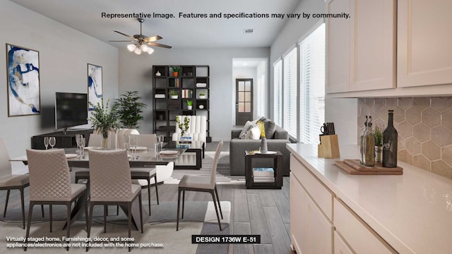 dining room featuring ceiling fan and light hardwood / wood-style flooring