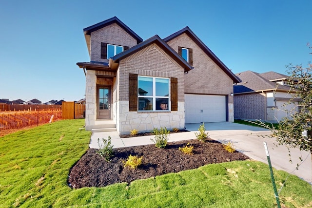 view of front of home featuring a garage and a front lawn