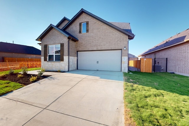 front facade featuring a garage and a front lawn